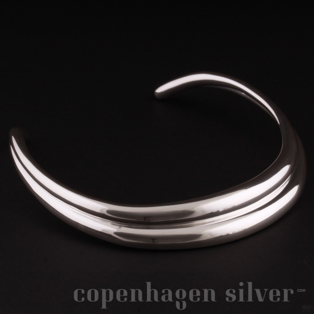 Lot 43 - A Georg Jensen silver neck ring and rutilated